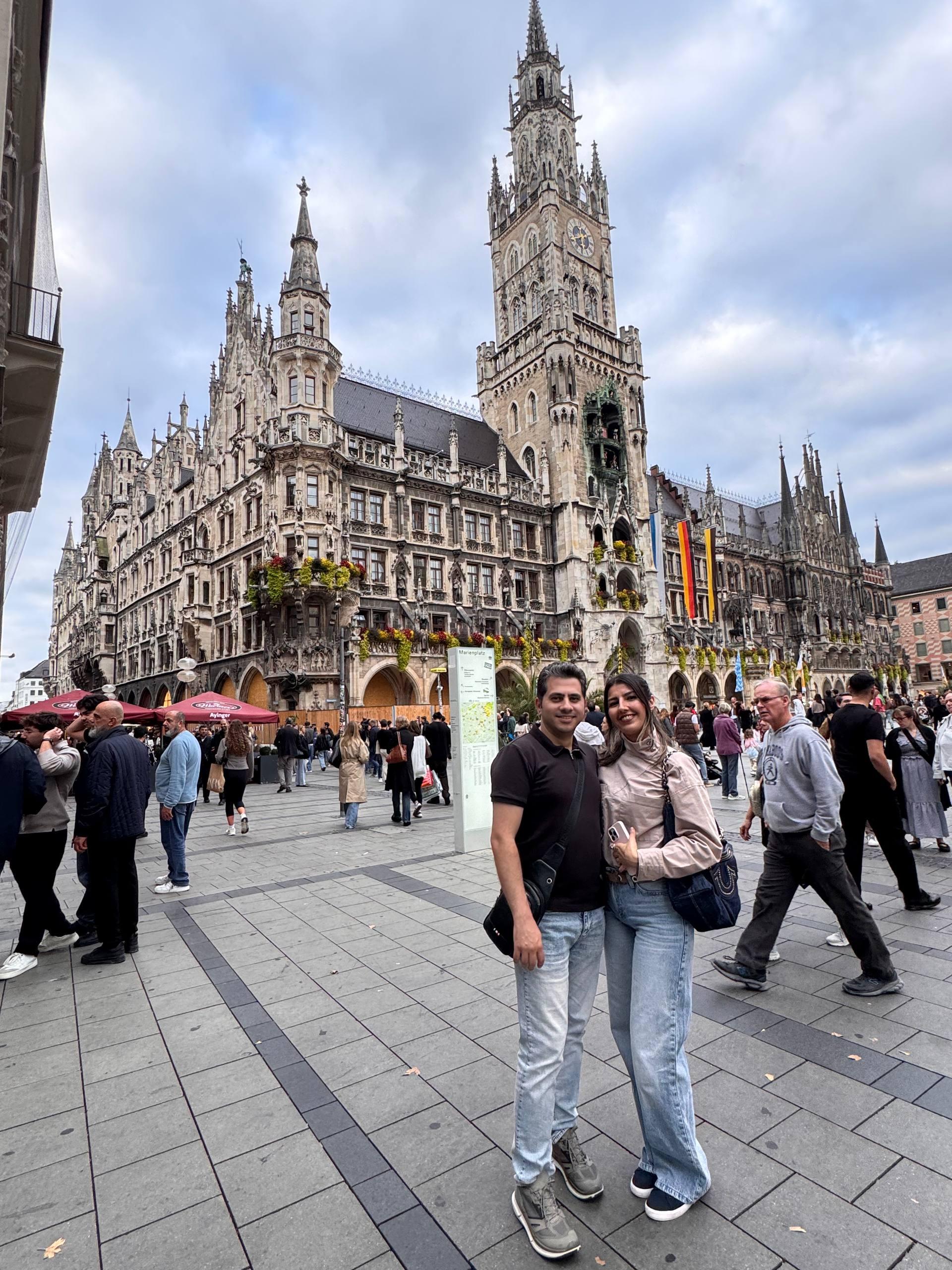 Mohammed and his wife standing in front of the Neues Rathaus, Munich's New Town Hall, at Marienplatz