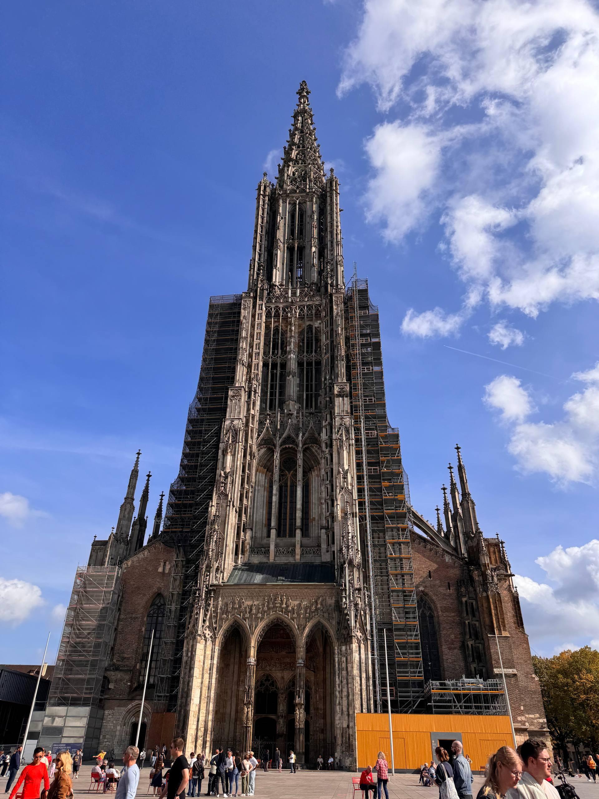The Gothic spire of Ulm Minster rising above the old town square