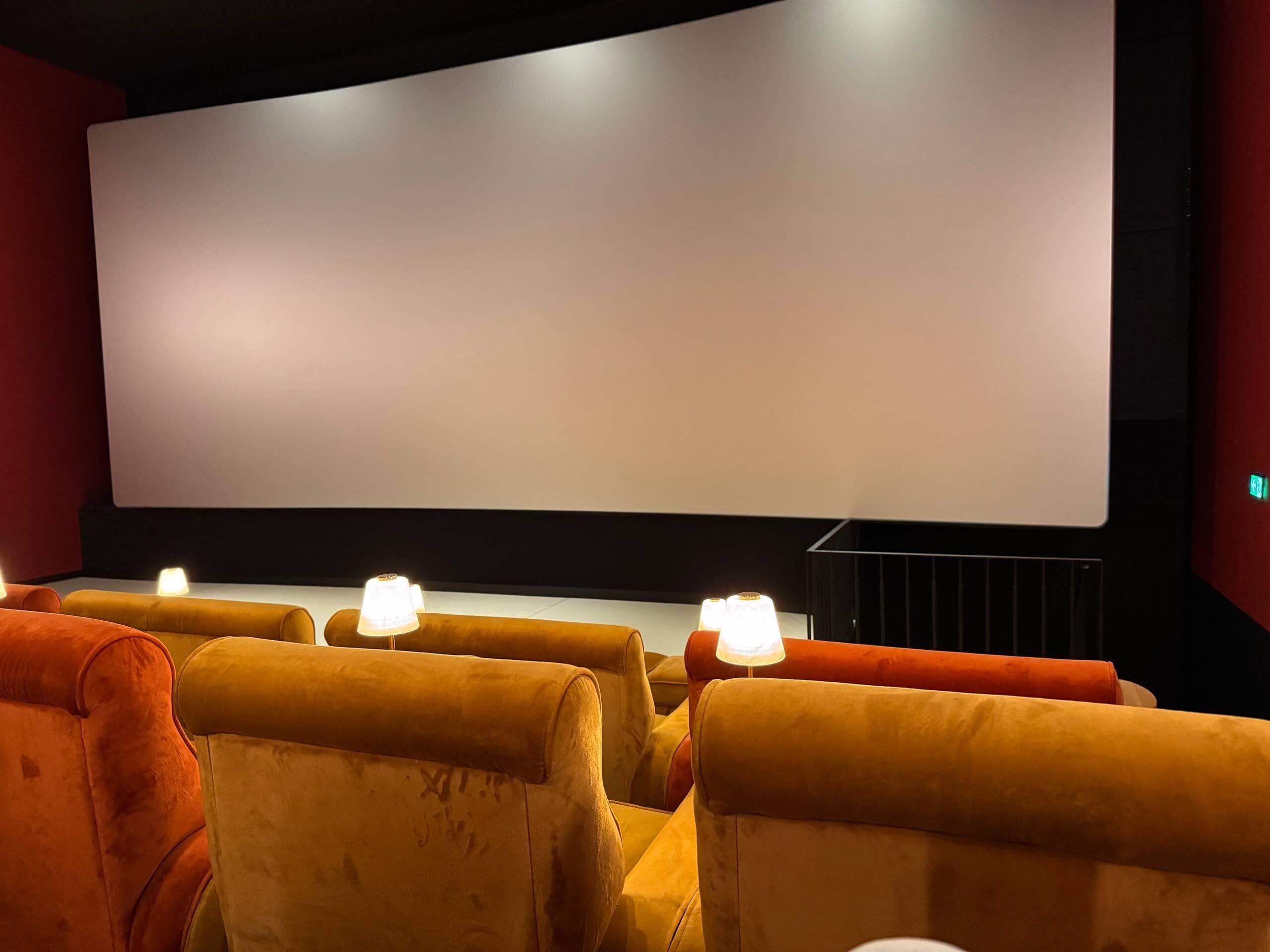The interior of Pathé Tuschinski cinema in Amsterdam, with velvet seats facing the screen