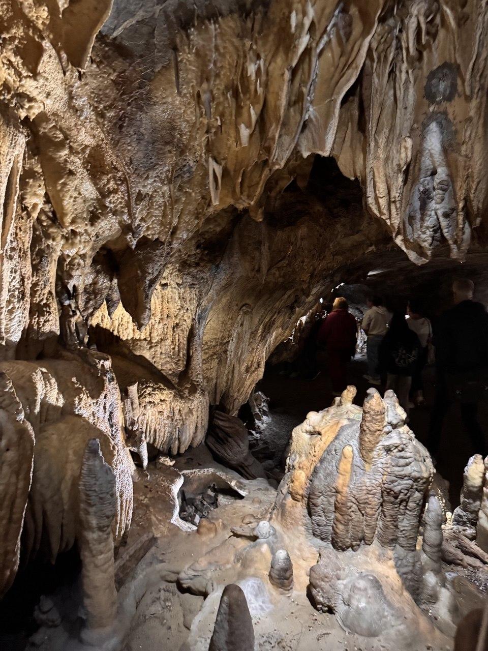Our group walking through the illuminated passages of the Dechenhöhle on a guided tour