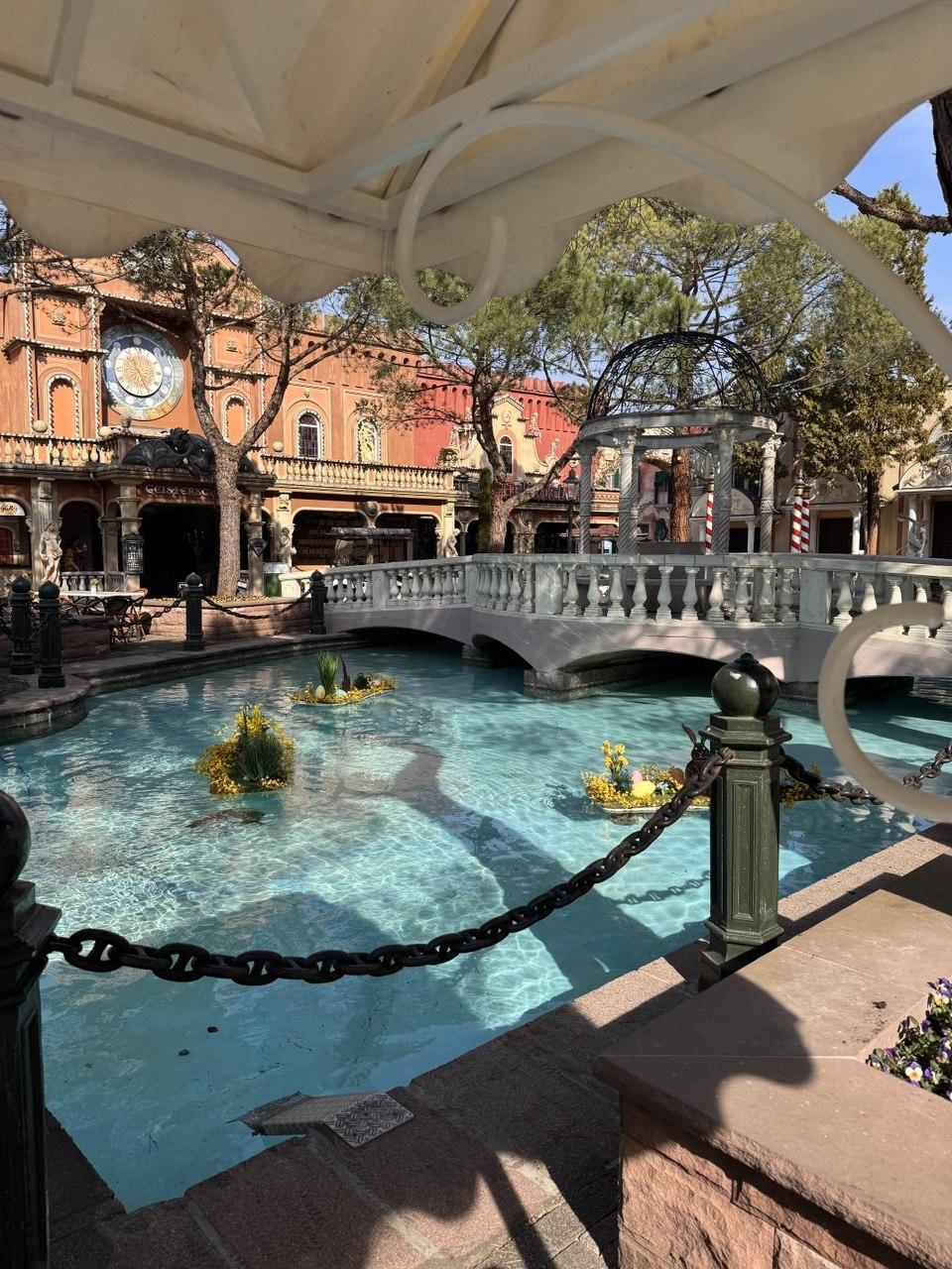 A canal and stone bridge in the Italy-themed area of Europa-Park